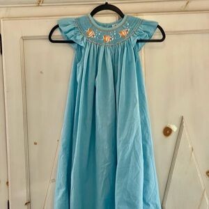 Castles & Crowns Smocked Dress Size 7
w/yellow fish
Aqua Blue Plaid Cap Sleeves